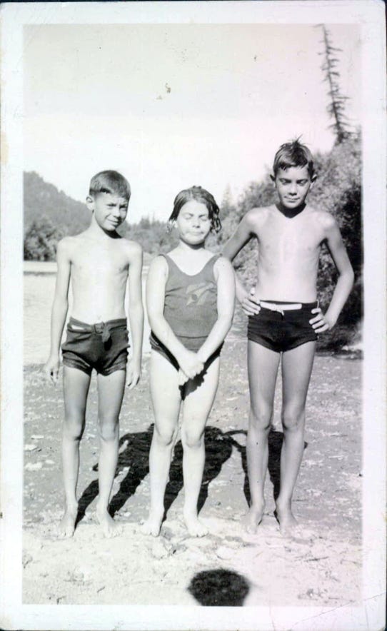 John, Marion and Justy The bathing beauty of Schoolhouse as a kid with uncle John, our founder and cousin Justy. These are all Ridenhour kids int he 1930's.