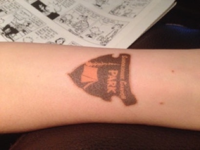 Schoolhouse logo tattoo