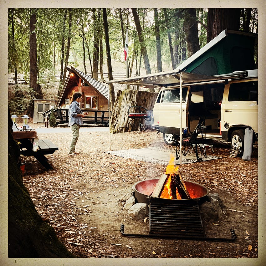 Site 24 campfire and Westfalia looking out twards camp office